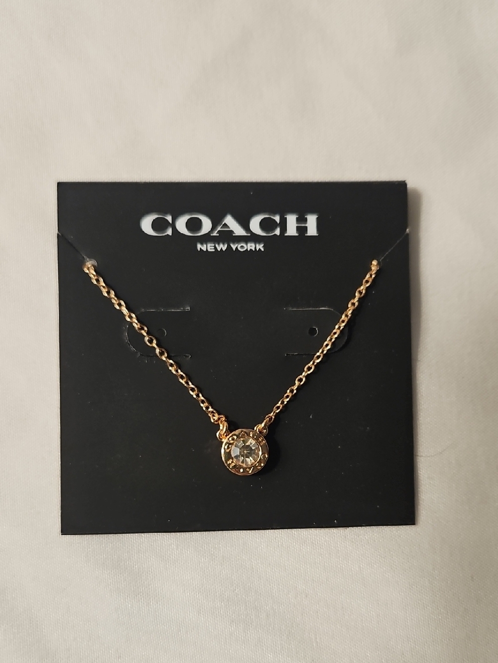 Coach Gold-Tone Crystal Bezel Pendant Necklace - Gold